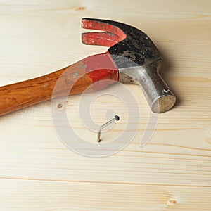 Composition of hammer and nail