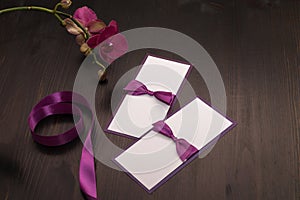 Composition with handmade cards and orchid flower in purple colo