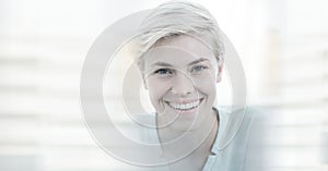 Composition of happy caucasian busineswoman looking at camera and smiling with double exposure