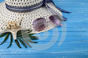 Composition with hat, sunglasses and seashells