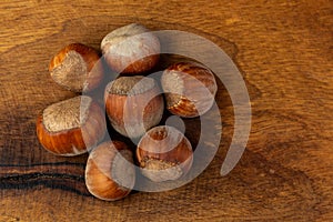 Composition of hazelnuts on a wooden board