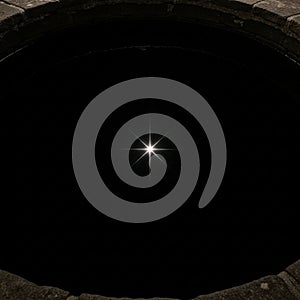 The composition highlights the interaction between light and