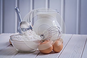 Composition of kitchen objects eggs corolla bowl