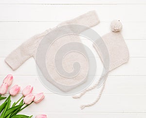 Composition of knitted suit and hat