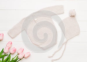 Composition of knitted suit and hat