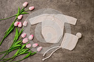 Composition of knitted suit and hat