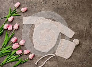 Composition of knitted suit and hat