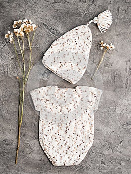 Composition of knitted suit and hat