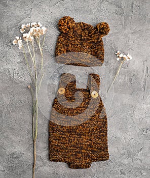 Composition of knitted suit and hat