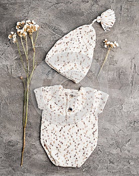 Composition of knitted suit and hat