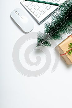 Composition of laptop with christmas tree, present and copy space on white background