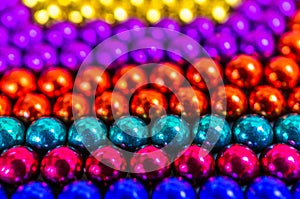 Composition from magnetic colorful metal balls - abstract background