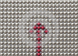A composition from magnetic silver metal balls with the open rounded red arrow