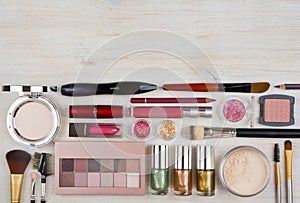 Composition of makeup products and cosmetics on table with copyspace