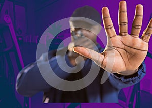 Composition of male security guard using walkie talkie holding hand out over purple background