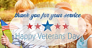 Composition of male soldier embracing smiling children over veterans day text