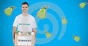 Composition of male volunteer carrying food donations in box with pear vector over blue background