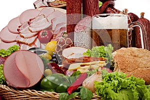 A composition of meat and vegetables with beer