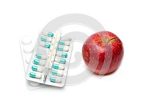 Composition with medicaments and apple. selective focus