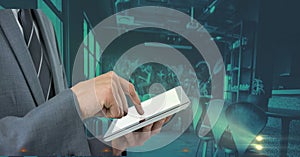 Composition of midsection of businessman using tablet over green interiors