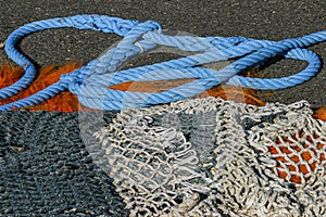 Composition of multi coloured artisanal fishing nets from a small fishing port