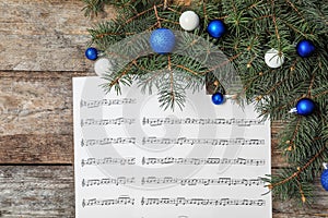 Composition with music sheets and Christmas decor
