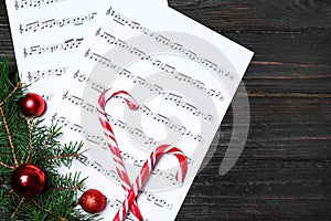 Composition with music sheets and space for text on wooden background