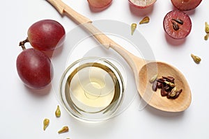 Composition with natural grape seed oil on background, top view. Organic cosmetic
