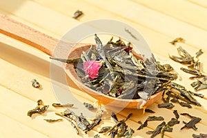 Composition of natural green tea with a leaves of rose. Macro ph