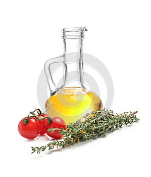 Composition with oil, tomatoes and herbs on white background