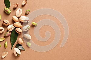 Composition with organic pistachio nuts on color background, flat lay