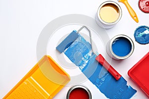 Composition with paint cans and space for text on white