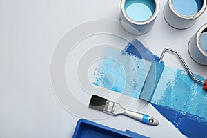 Composition with paint cans on white background photo