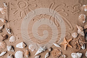 Composition with palm sun painted on sand seashells, pebbles, mockup on sand background. Blank, top view, still life