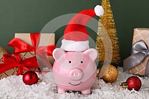 Composition with piggy bank and Christmas decor