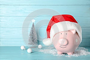 Composition with piggy bank and Christmas decor on table