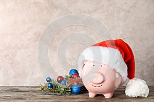 Composition with piggy bank and Christmas decor on table