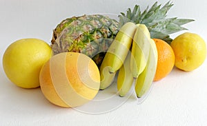 Composition of Pineapple, Orange, Grapefruits and Baby Bananas