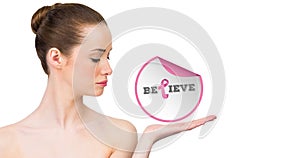 Composition of pink ribbon logo and belive text, with young woman