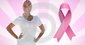 Composition of pink ribbon logo , with smiling woman on pink and white background