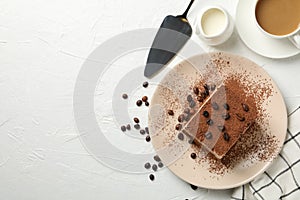 Composition with plate tasty tiramisu on white background. Delicious dessert