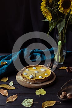 Pumpkin pie and decorative sunflowers