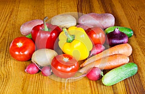 Composition with raw vegetables on wooden table