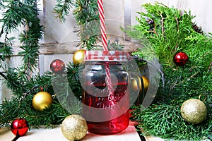 Composition with a red mug and Christmas balls