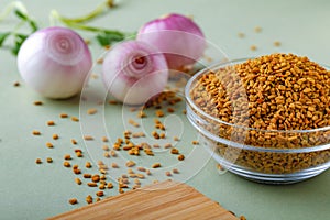 Composition of red onions and spices on table