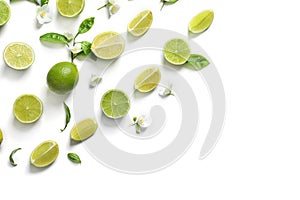 Composition with ripe limes on white background, top view
