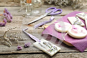 Composition with scented sachets on wooden table