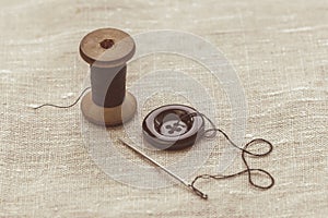 Sewing thread and for knitting? the gray thread and the needle and the button