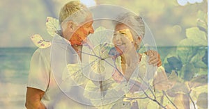 Composition of senior couple embracing on beach and autumn foliage