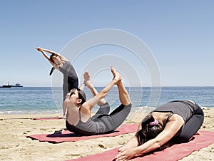 Composition of several bikram yoga poses at beach photo